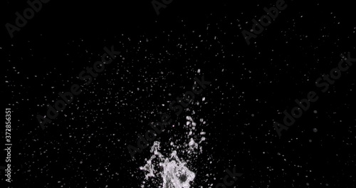 water splattering up on a black background.