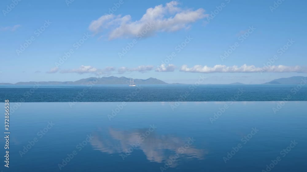 ocean View From pool To The Ocean To A Line Of Clouds In The Sky ocean View From pool To The Ocean To A Line Of Clouds In The Sky