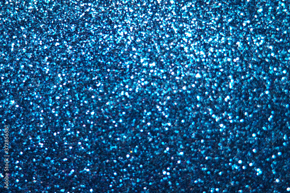 Fototapeta premium blue Sparkling Lights Festive background with texture. Abstract Christmas twinkled bright bokeh defocused and Falling stars. Winter Card or invitation 