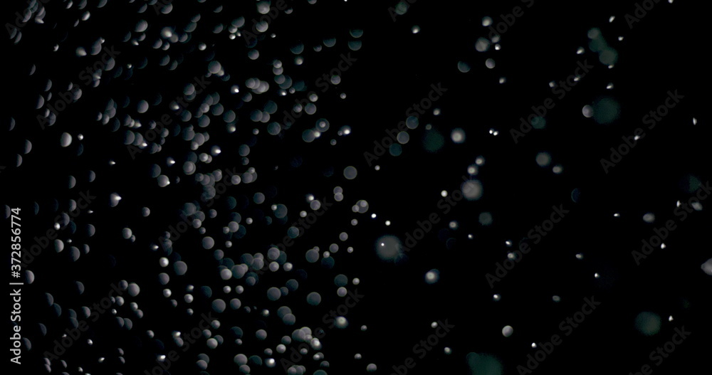 Shiny snowflakes dropping from the sky slowly. The video was shot while the snowflakes were on an isolated black background. Shiny snowflakes dropping from the sky slowly. The video was shot while the snowflakes were on an isolated black background.