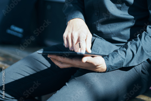 Manager with a tablet in hands outdoors technology communication