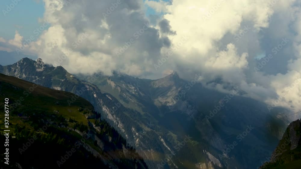 Beautiful Timelapse of Sunset and Clouds Rolling over Mountains - Switzerland Beautiful Timelapse of Sunset and Clouds Rolling over Mountains - Switzerland