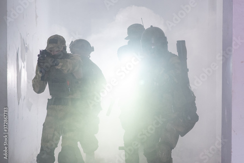 Airsoft team make a takeover of a building in smoke