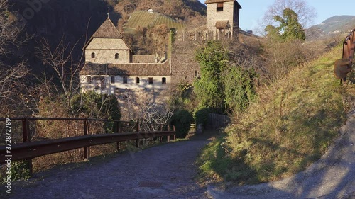 Tilting reveal of Runkelstein castle, a historic medieval fortress in Bolzano Bozen. Alps, Italy photo