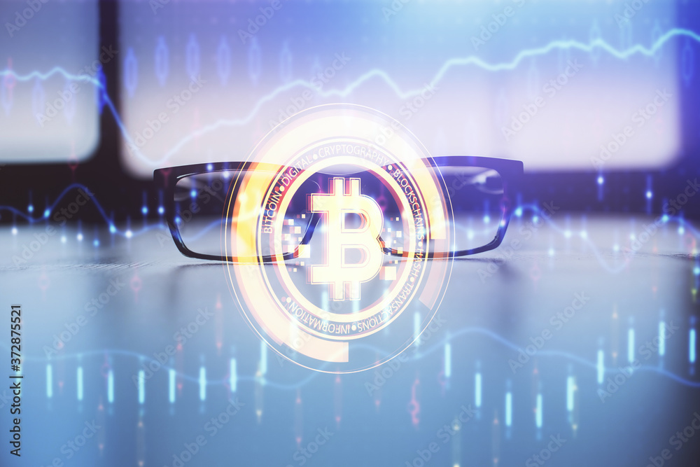 Obraz premium Crypto theme hologram with glasses on the table background. Concept of blockchain. Double exposure.