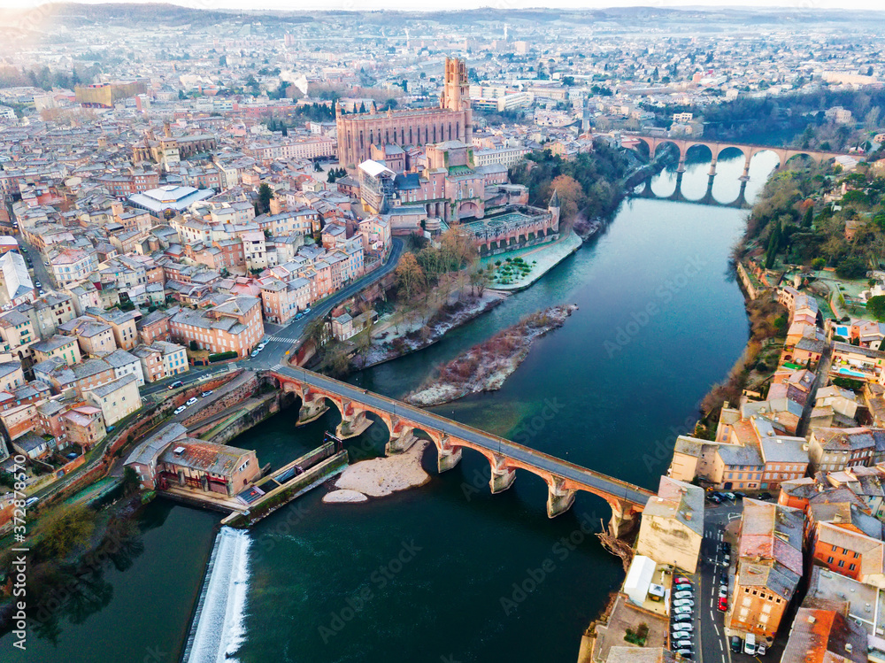 Panoramic aerial view of French city of Albi, Cathedral Basilica of Saint Cecilia and bridges over river Tarn