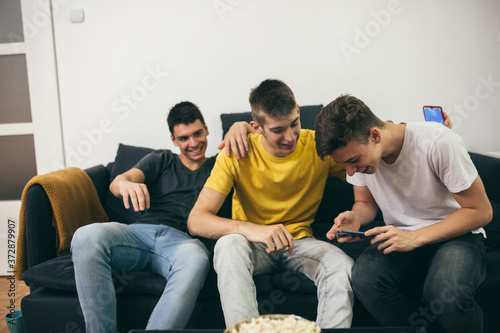 teenagers using mobile phones at home