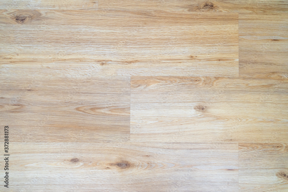 Wood laminate flooring texture background. Light wooden textured interior floor. Wood laminate flooring texture background. Light wooden textured interior floor.