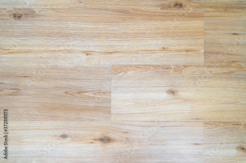 Wood laminate flooring texture background. Light wooden textured interior floor.