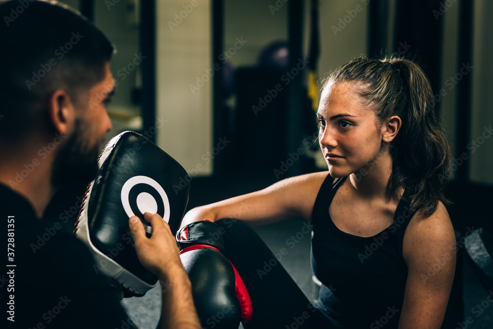Obraz premium woman kick boxing or boxing training