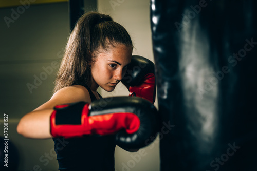 woman kick boxing or boxing training © cherryandbees