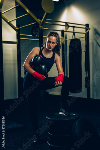 woman kick boxing or boxing training photo