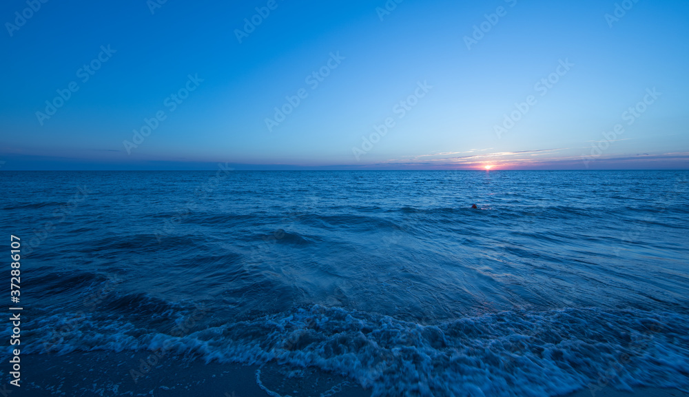 Fototapeta premium colorful sea sunset and orange sun