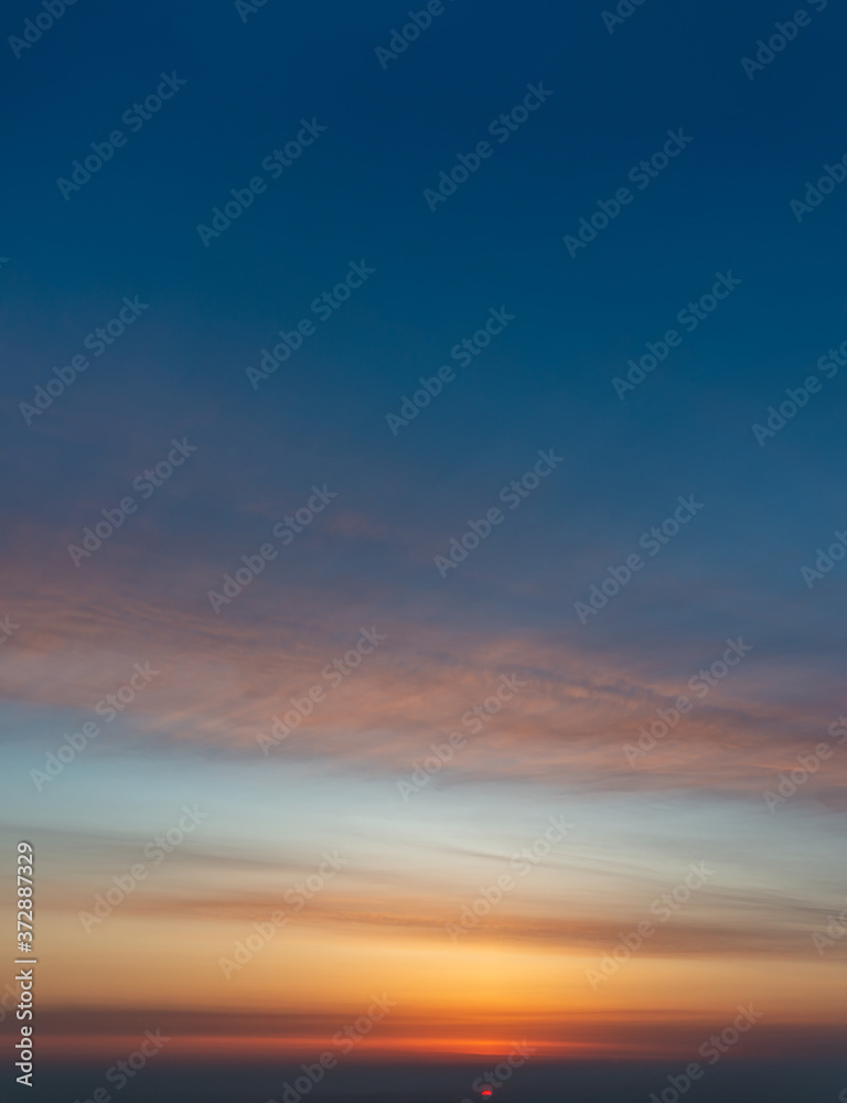 Fantastic clouds at sunrise, vertical panorama