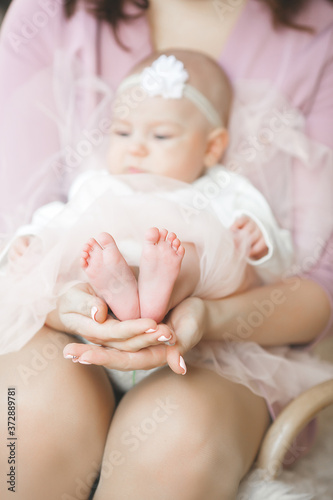 Little cute baby`s feet closeup photo