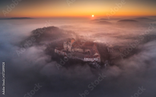 Drone aerial photo of Tyniec Abbey in mist near Krakow in Malopolska, Poland 