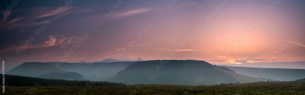 The colors of the sunrise. Panorama of Brecon Beacons National Park in Wales.