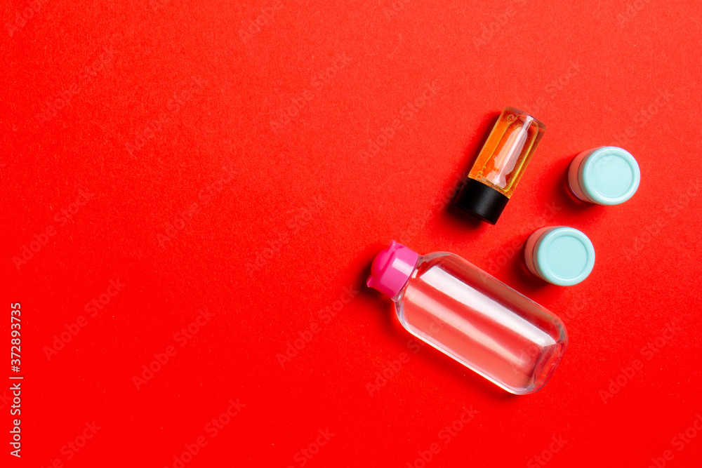 Cosmetics SPA branding mock-up, top view with copy space. set of tubes and jars of cream flat lay on colored background Cosmetics SPA branding mock-up, top view with copy space. set of tubes and jars of cream flat lay on colored background