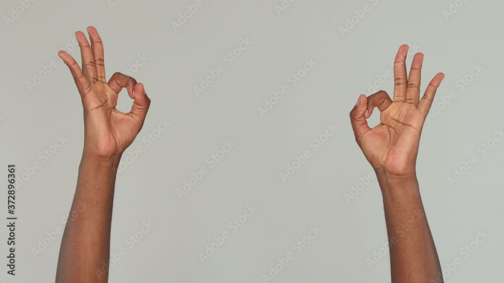 Cropped close up african american man guy male applause cheering clapping hands ok okay isolated on gray color background in studio. Copy space advertisement place for text Advertising area mock up Cropped close up african american man guy male applause cheering clapping hands ok okay isolated on gray color background in studio. Copy space advertisement place for text Advertising area mock up