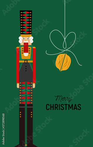 Christmas greeting card with nutcracker and nut