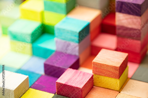 Tela Spectrum of stacked multi-colored wooden blocks