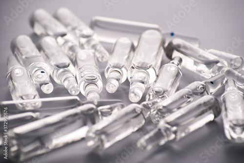 Photo medical ampoules on a white background. Close-up