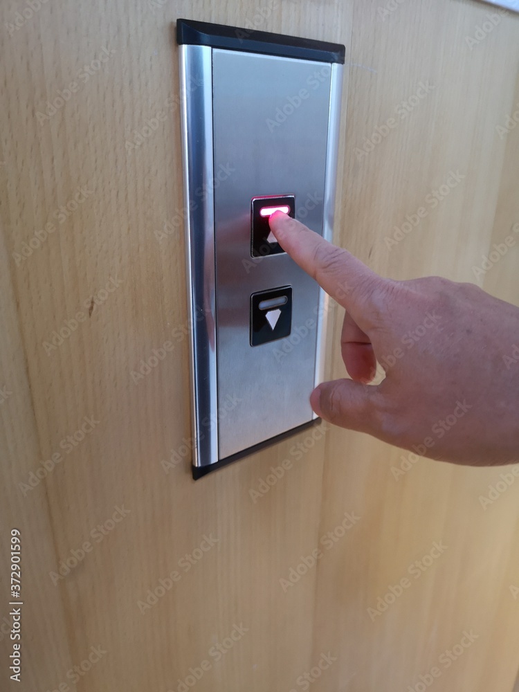 Use index finger to press the elevator button up and down Use index finger to press the elevator button up and down