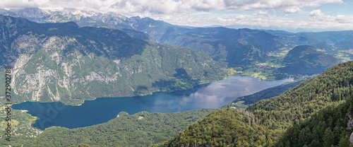 birds view of lake Bohinj in Slovenia. view from the top of Vogel mountain with the julian alps in the background