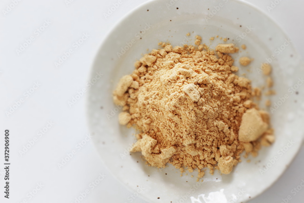 Japanese food ingredient, soy powder on dish with copy space Japanese food ingredient, soy powder on dish with copy space