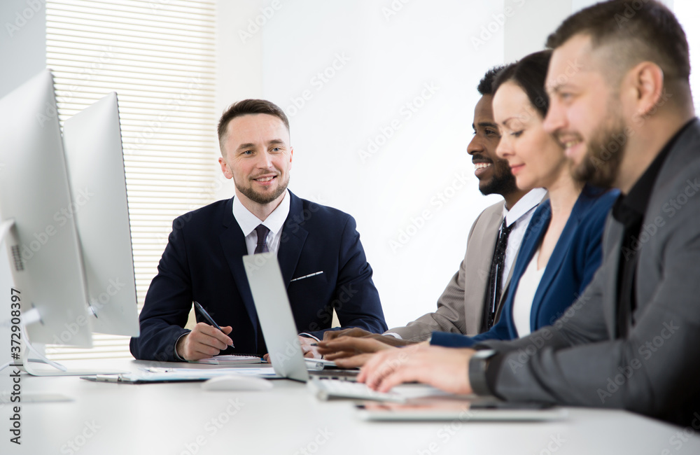Multy-ethnic group of business people working at office Multy-ethnic group of business people working at office