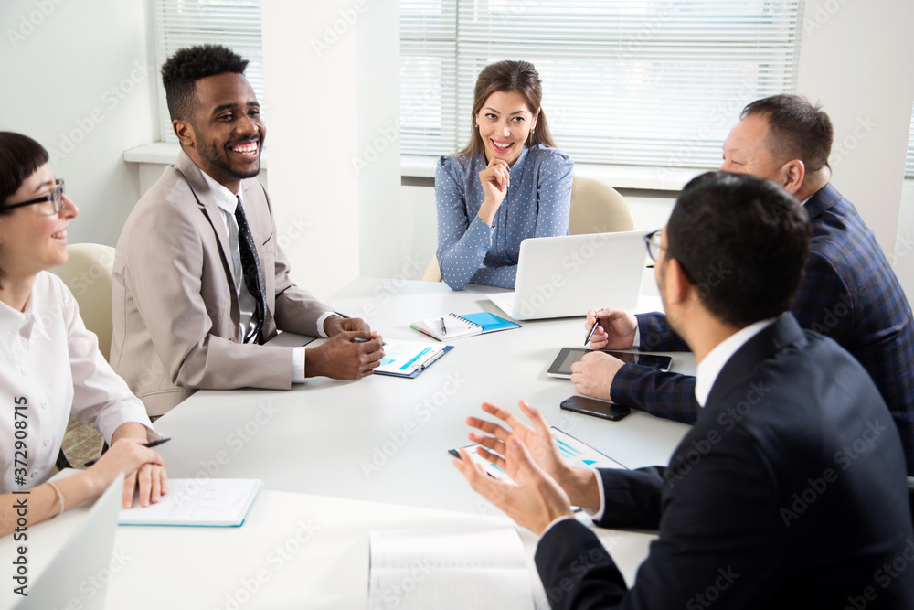 Multy-ethnic group of business people working at office Multy-ethnic group of business people working at office