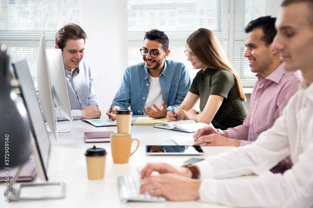 Multy-ethnic group of business people working at office Multy-ethnic group of business people working at office