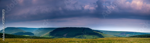 The colors of the sunrise. Panorama of Brecon Beacons National Park in Wales.