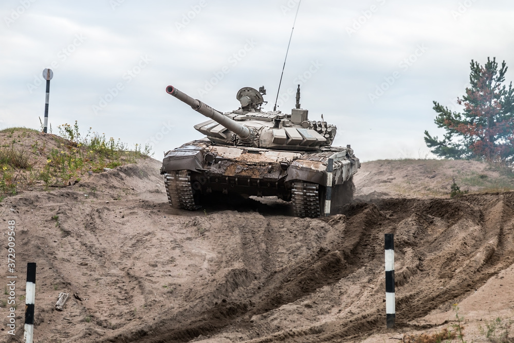 battle tank performs driving exercises for military equipment at the tankodrome battle tank performs driving exercises for military equipment at the tankodrome