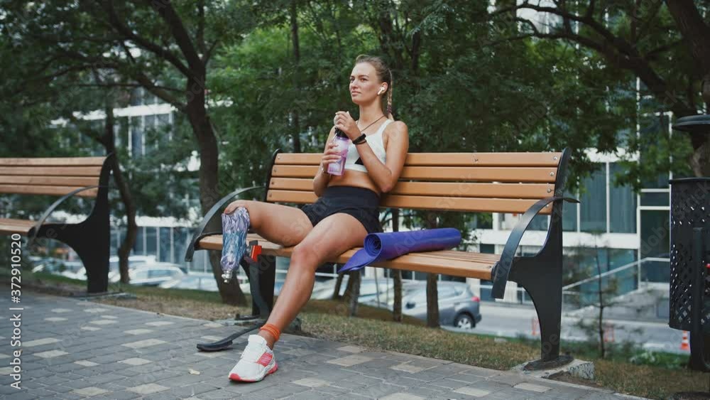 custom made wallpaper toronto digitalDisabled woman resting on bench after intensive training, drinking water