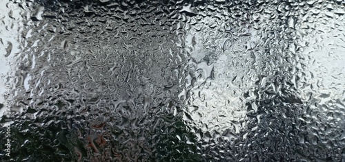 Top view the water drop on the glass background.
