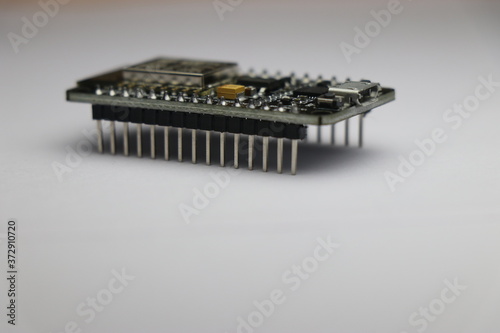 Side view of development board which is used in making IOT projects and other mini electronic projects in white background