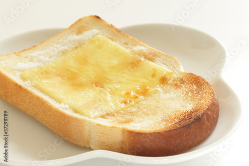 sliced cheese and sugar on toast for asian broakfast