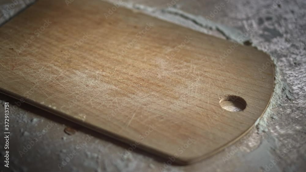 Close-up of pizza on a wooden cutting board. 4k footage