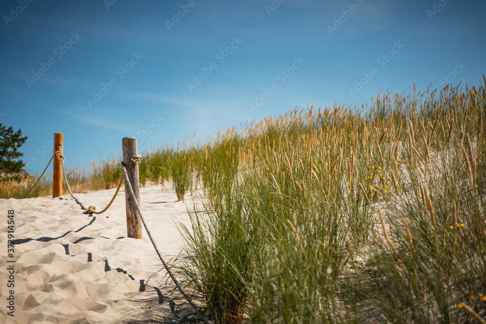 Rope railing on sandy beach - Leba, Poland