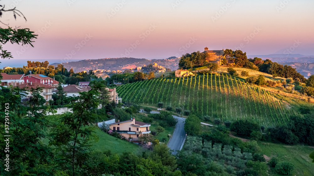 Beautiful sunset on the countryside of Marche in a summer evening
