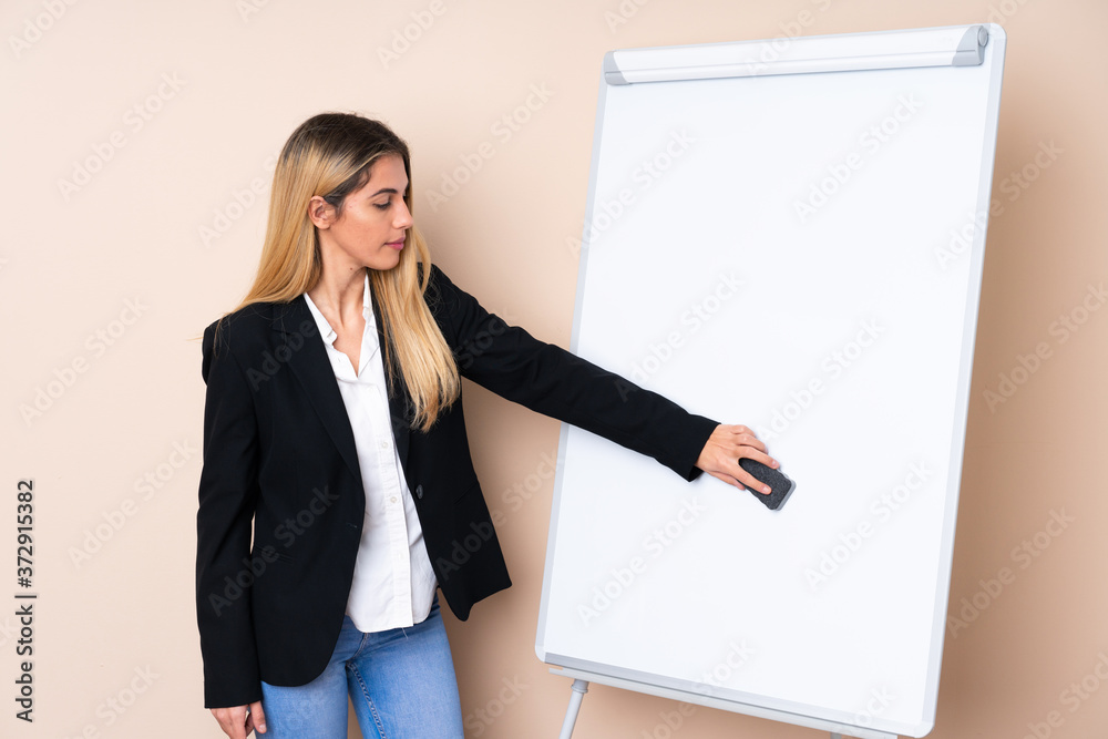 Young Uruguayan woman giving a presentation on white board Young Uruguayan woman giving a presentation on white board