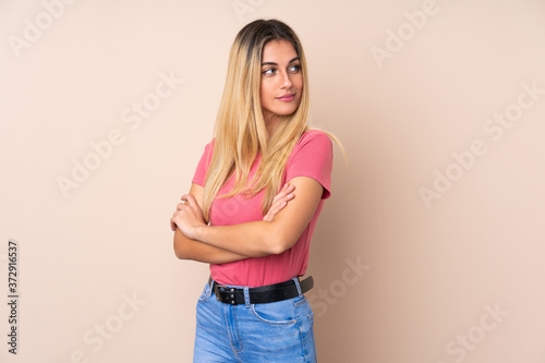 Young Uruguayan woman over isolated background portrait