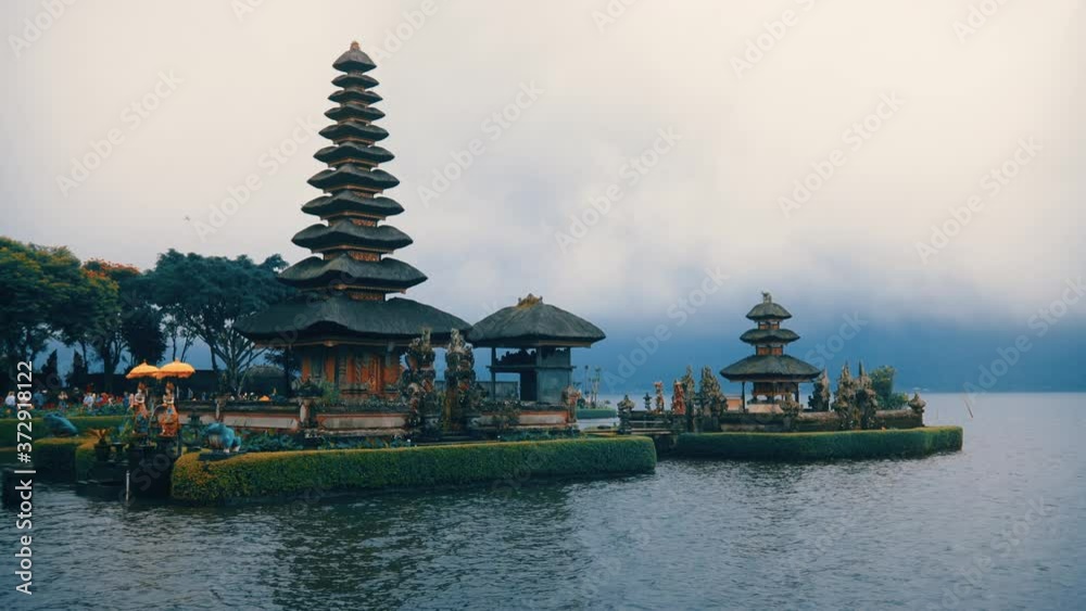 Temple by the water with cloudy sky in bali