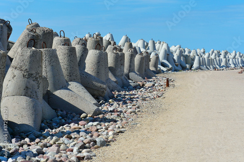 Concrete tetrapods for the breakwater cliff of the port photo