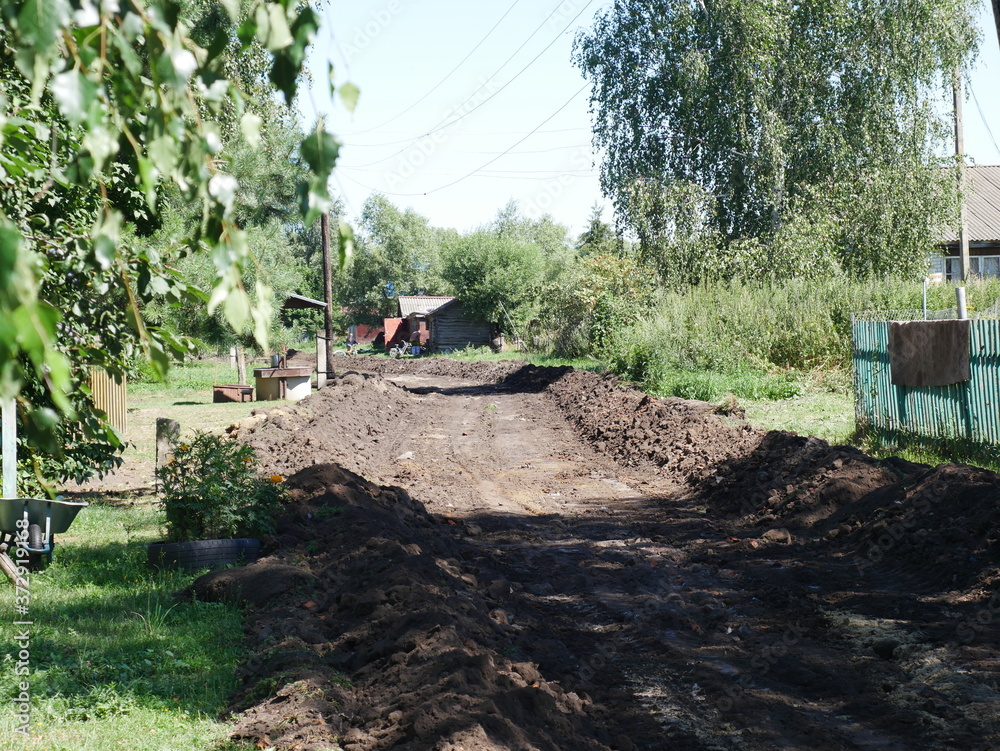 construction work to repair the road. In the village. Dug-up road