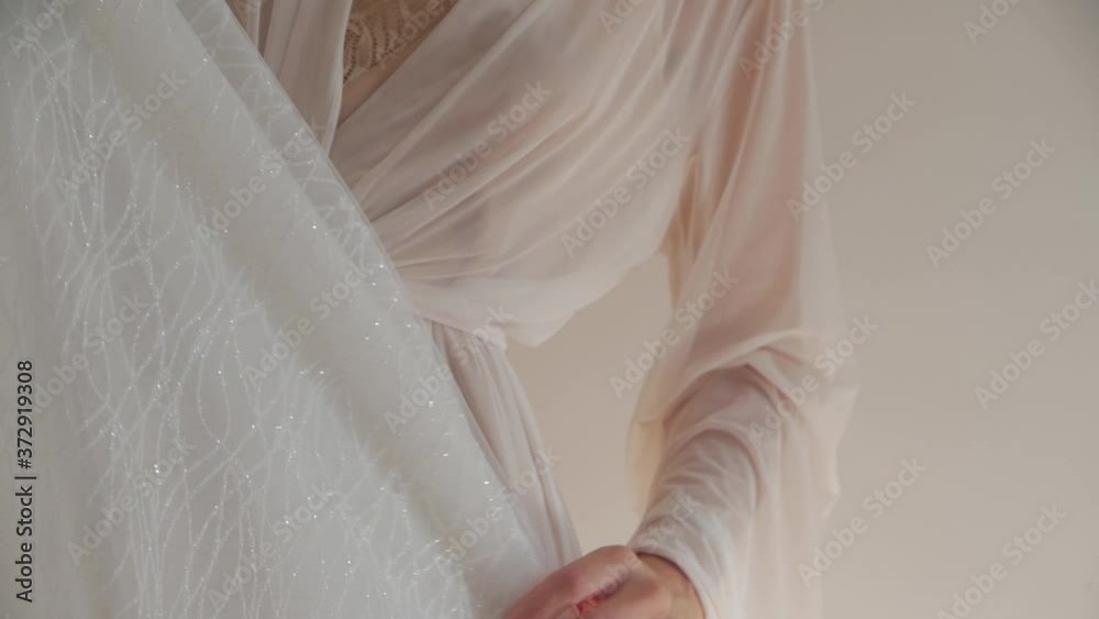 Bride holding dress unrecognizable girl closeup of a hand with a wedding ring slow motion Bride holding dress unrecognizable girl closeup of a hand with a wedding ring slow motion