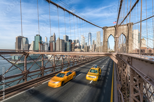 View of the Lower Manhattan skyline from the Brooklyn Bridge in New York City, USA © eyetronic