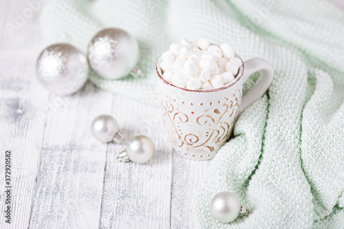 Mug with coffee and marshmallow on wooden table . Cozy christmas composition. Hygge concept Soft focus - Image