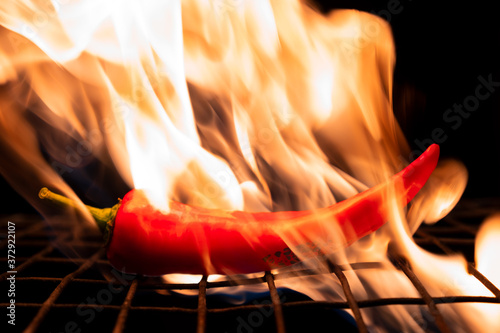 red hot chili peppers are on fire on a metal grill